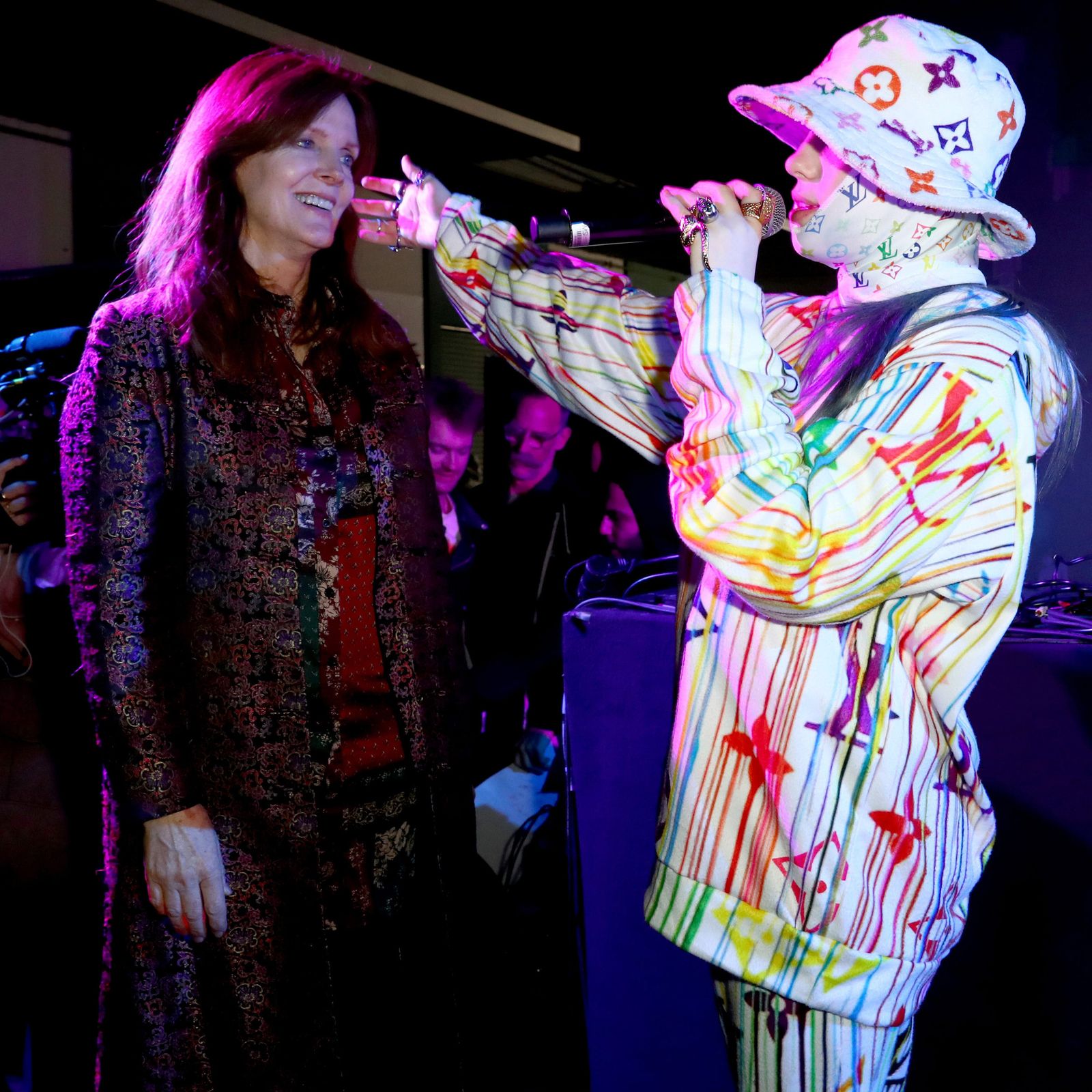 This image may contain Hat Clothing Apparel Human Person Costume Crowd Stage and Performer