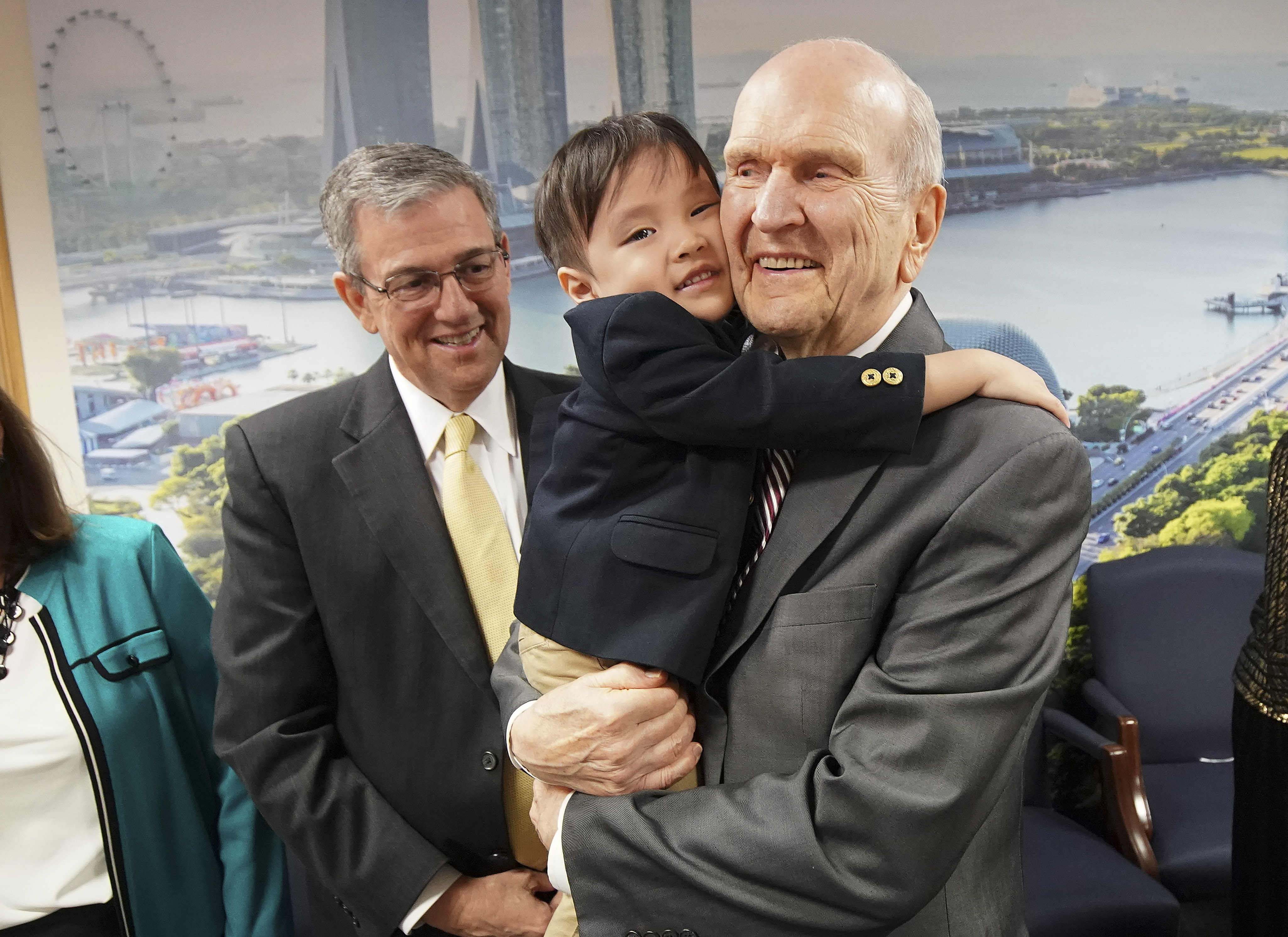 President Russell M. Nelson of The Church of Jesus Christ of Latter-day Saints hugs Tate Chan, 3, while meeting with a three-generation family in Singapore on Nov. 20, 2019.