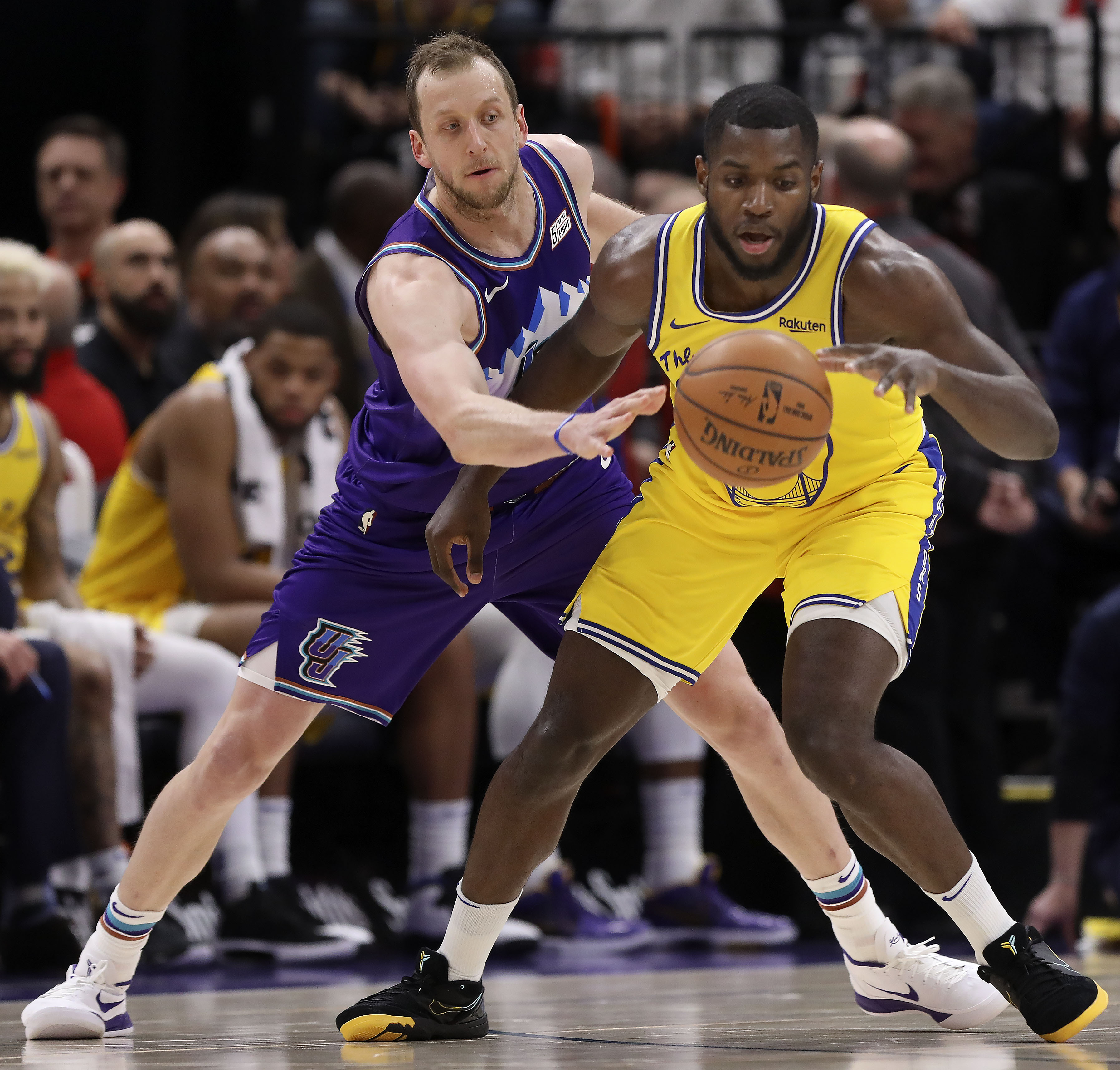 Utah Jazz forward Joe Ingles (2) guards Golden State Warriors Eric Paschall at Vivint Arena in Salt Lake City on Friday, Nov. 22, 2019.