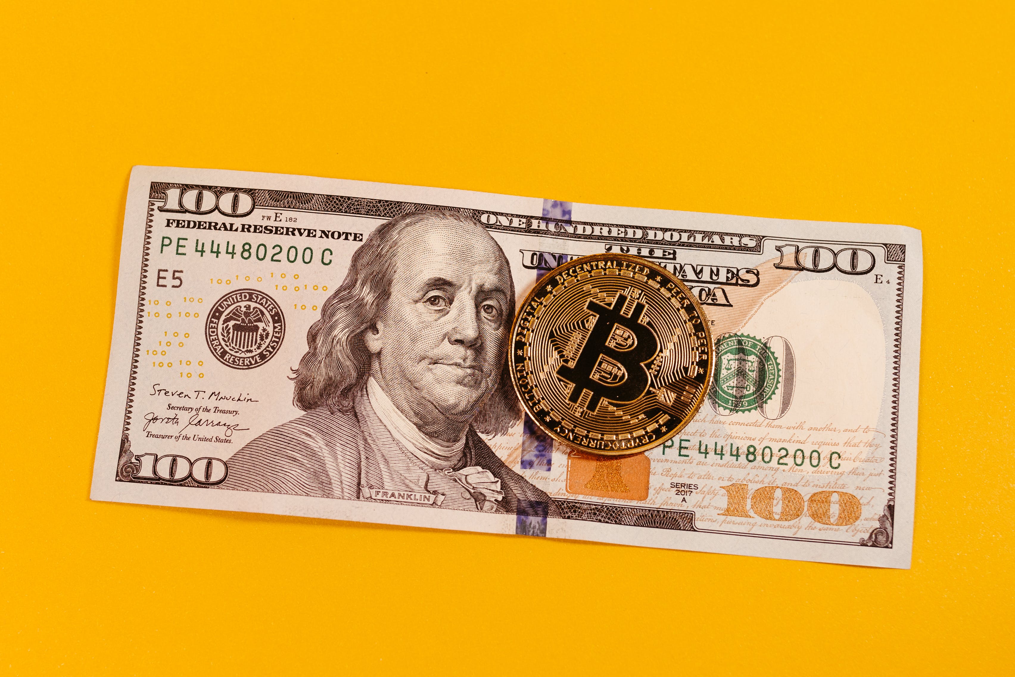 100 dollar and a bitcoin