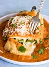 Chile Rellenos. This classic recipe is a Tex Mex favorite! A fried chile stuffed with cheese and smothered in a red spanish style sauce.