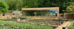 horizontal building with large window looking out over garden