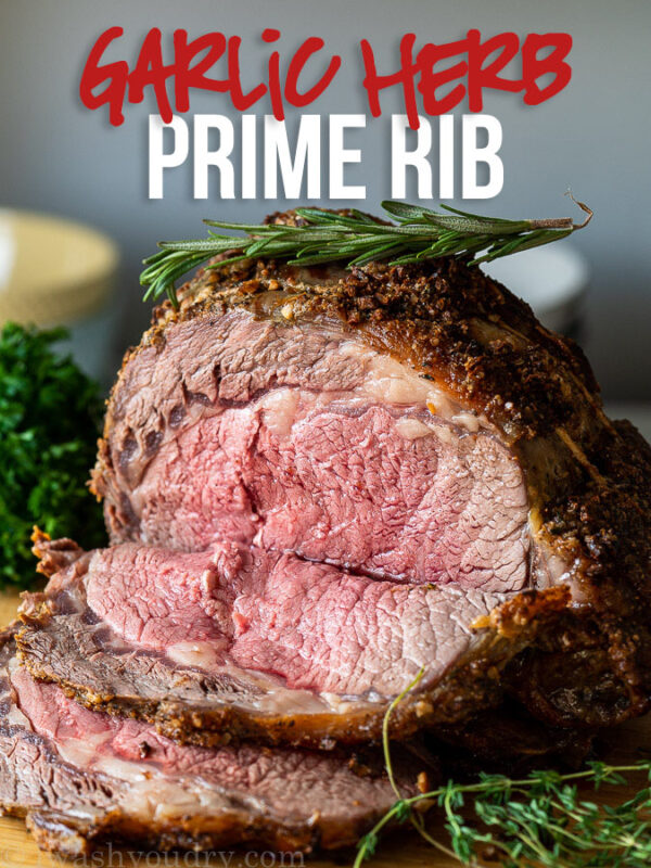 This is the BEST Garlic Herb Prime Rib Recipe! Seasoned with fresh garlic and herbs and roasted to perfection!