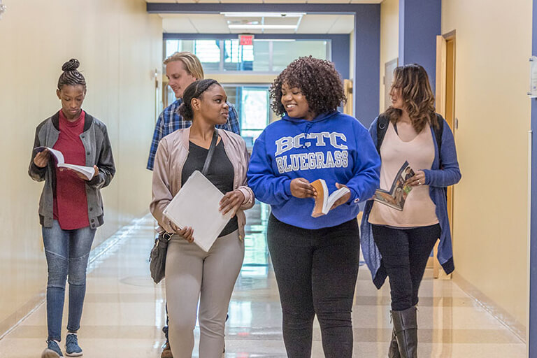 students walking down hallway