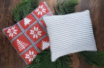 Christmas pillows made of individual crochet squares. Each square has a winter image. These holiday pillows are made by tapestry crochet with Lion Brand Yarn. Free pattern + tutorial.