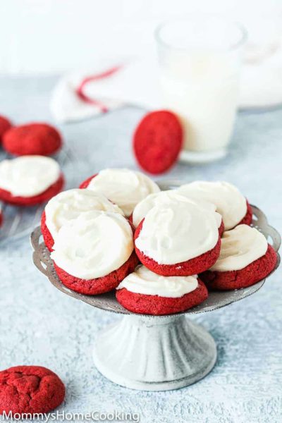 eggless red velvet cookies with cream cheese frosting in a cookie stand