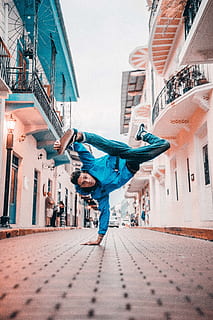 man, break, dancing, street, balance, bboy, cool, dance, dancer, daylight, fashion, fun, panama, pavement, performance, person, pose, town, wear, architecture, built structure, building exterior, one person, city, full length, lifestyles, real people, leisure activity, building, casual clothing, day, footpath, sky, young adult, rear view, motion, human arm, nature, outdoors, 5K, CC0, public domain, royalty free