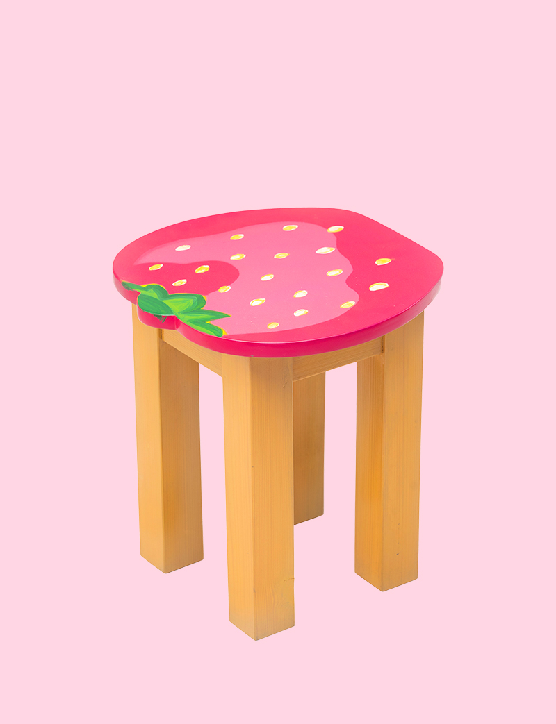 a Strawberry shape chair with wooden legs