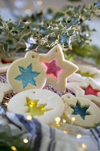 A photo of Stained glass cookies lit with small lights from behind