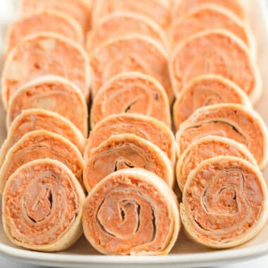 Buffalo Chicken Pinwheels are bursting with spicy buffalo flavor and savory blue cheese. They are the ULTIMATE football food - they'll disappear faster than you can say "touchdown!"