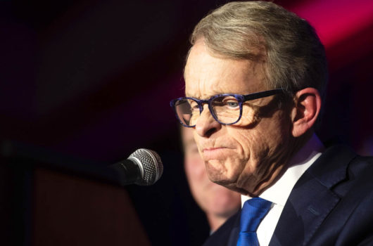 [Photo: Gov. Mike DeWine pauses during an event.]