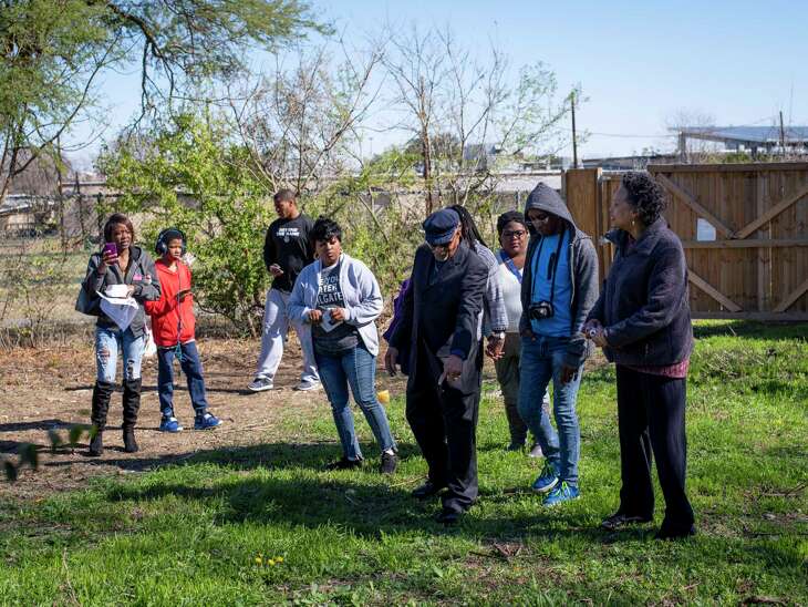 Velmil Clay, 76, fourth right in hat, whose father and three brothers are buried at the historic and long forgotten African American Hockley-Clay cemetery, describes the way his grandmother used to select plots for burial to fellow descendants of relatives buried at the cemetery in San Antonio, Texas, on Thursday, January 11, 2020. The Hockley-Clay Cemetery is a long forgotten African American graveyard from the late 1800s, located on the Northeast Side. Descendants of relatives buried at the cemetery visited the site on Saturday following a panel discussion on the progress being made to improve the cemetery grounds.