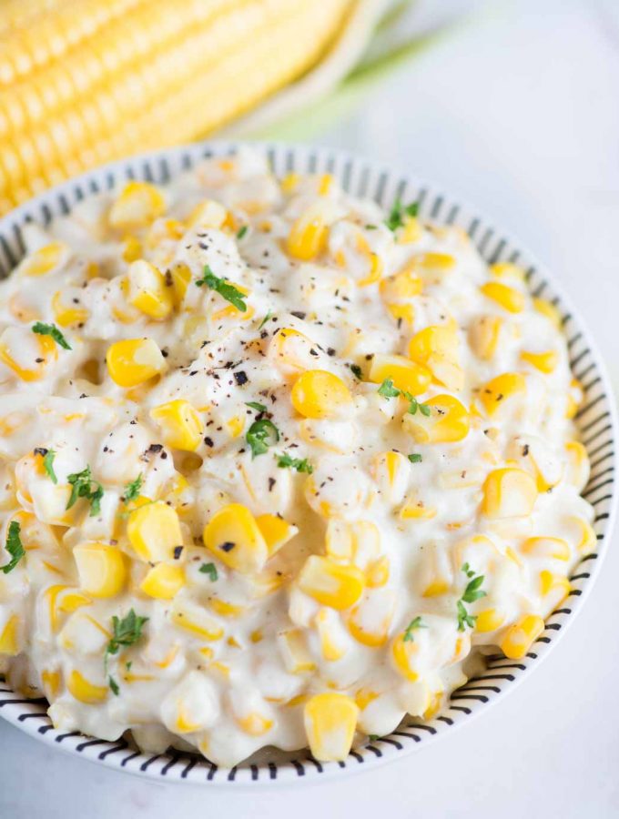 Learn how to make Creamed Corn from scratch. Fresh Corn, butter, flour roux and half& half is all you need to make this easy and creamy creamed corn recipe.