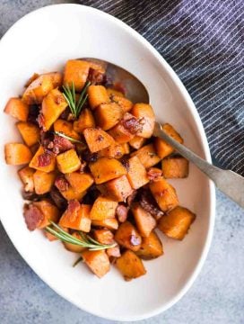 Maple Bacon Sweet Potato Hash with a hint of cinnamon and rosemary is easy to make. A perfect side dish to serve with your dinner or thanksgiving dinner.