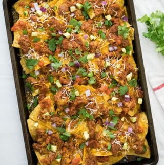 bbq pulled pork nachos on baking dish