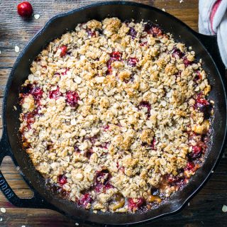 cranberry apple crisp in iron skillet