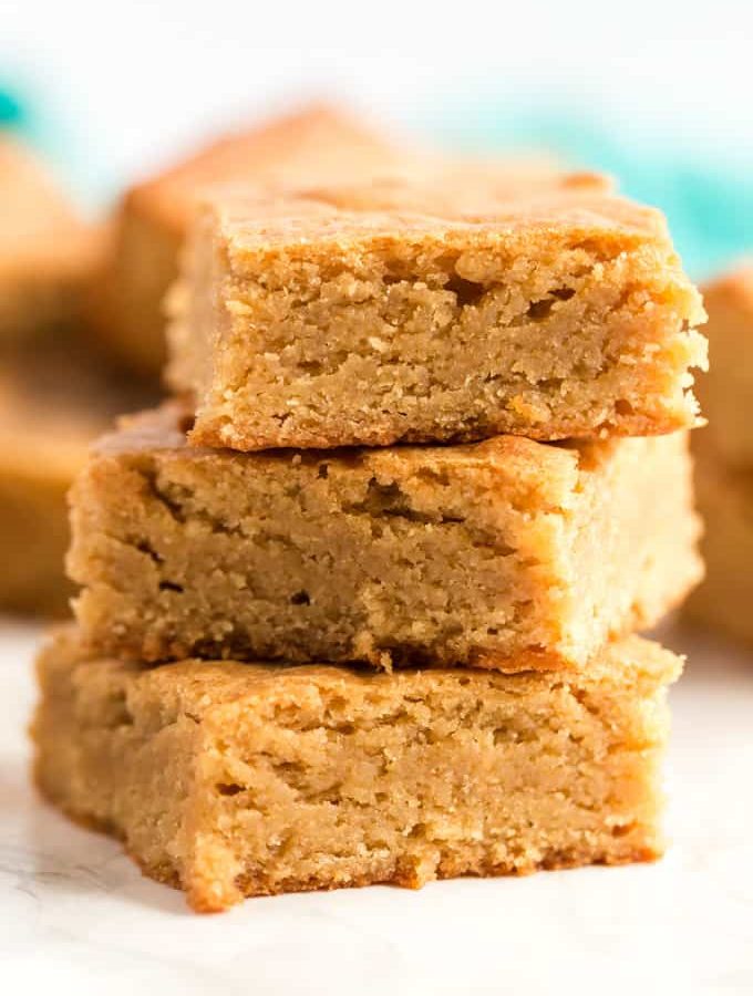 Blondies in a stack on a white background
