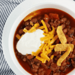Cowboys love their chili, but you don't have to be a cowboy to appreciate this hearty slow cooker cowboy chili recipe. Made usingHurst BBQ Style Cowboy Beans with seasoning packet, ground beef, diced green chiles and a few other ingredients, this slow cooker chili recipe couldn't be any simpler.