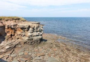 Cliffs in Caraquet, New Brunswick overlooking the St. Lawerence Bay and a slate covered shoreline