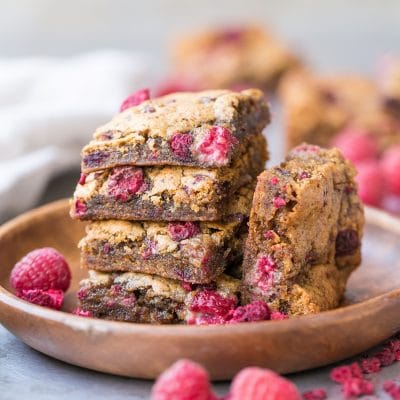 These Raspberry Blondies are incredibly soft and chewy and full of bright berry flavor. These gluten-free, Paleo and vegan blondies are made with cashew butter, coconut flour, and fresh raspberries!
