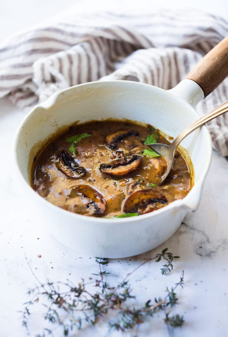 An easy recipe for Mushroom Gravy that is vegetarian (vegan-adaptable) healthy and full of flavor. #mushroomgravy #vegangravy #gravy