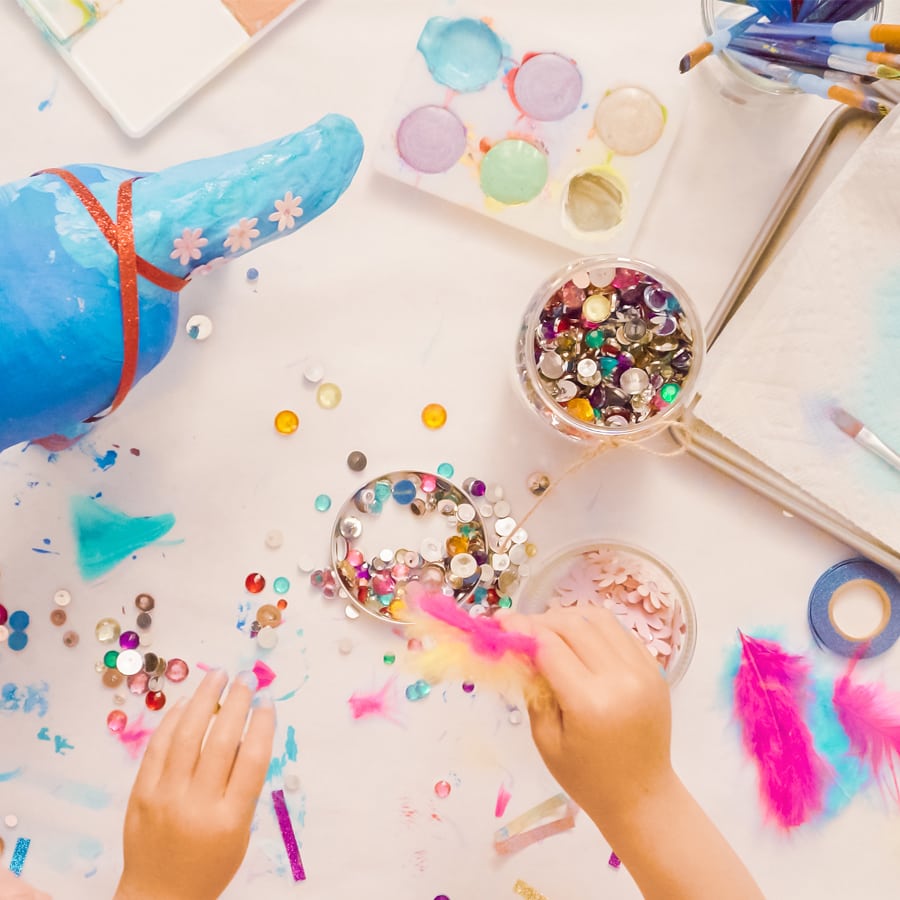 person crafting with bright colors