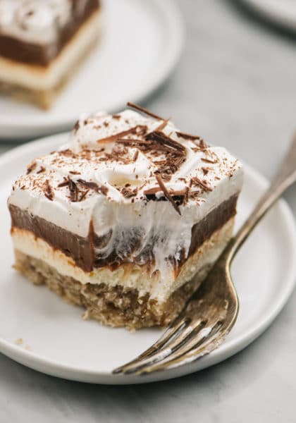 chocolate delight served on a white plate with a bite taken out