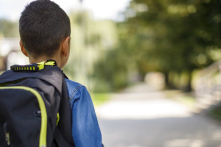 school refusal_boy with schoolbag