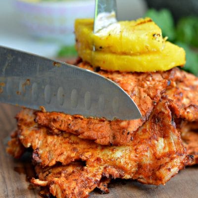 Tacos al Pastor - made with slow marinated pork, grilled to perfection, and served with grilled pineapple.