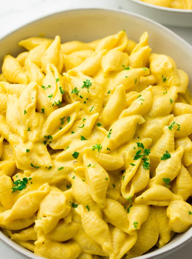 close up photo of bowl of butternut mac and cheese with parsley