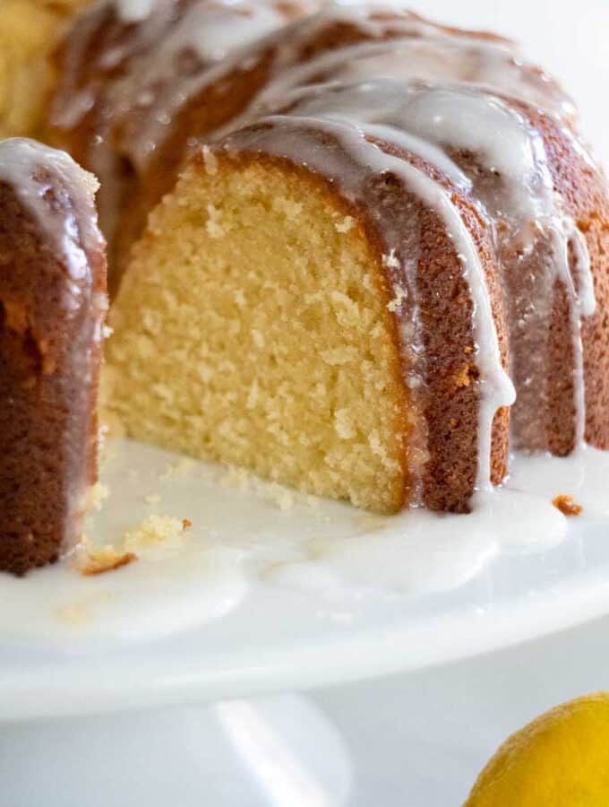 lemon bundt cake on white cake stand