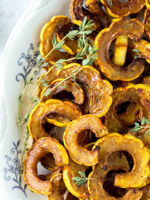 roasted delicata squash on a serving dish