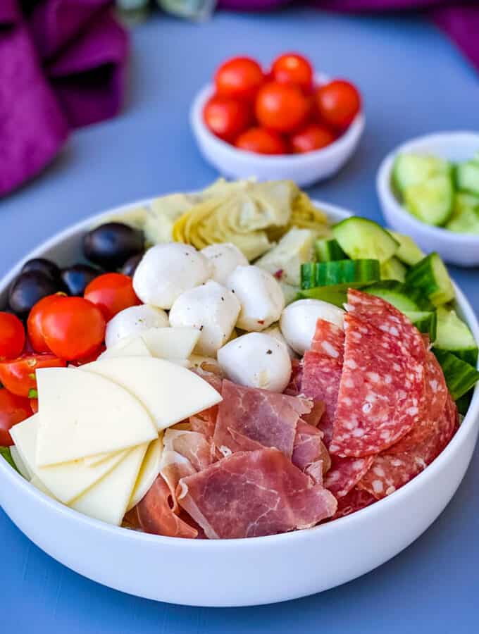 antipasto salad in a white bowl