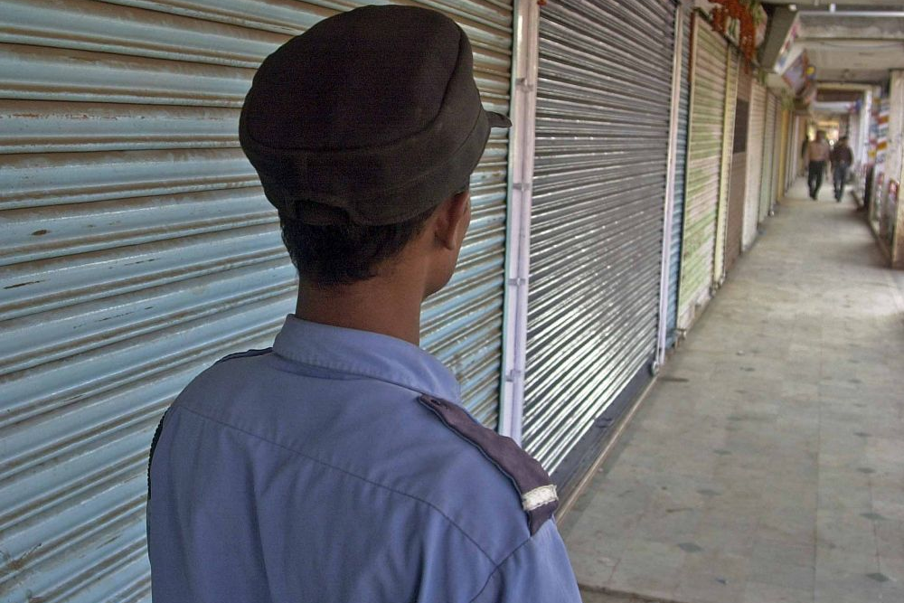 A security man stand guards the shops in Raipur. File photo: Akhilesh Kumar