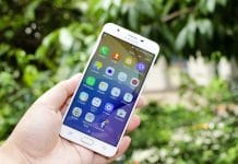 crop hand holding a Samsung j7 phone