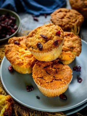 Cranberry Orange Muffins served on a plate.