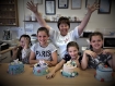 https://www yellowbutterflycakes co uk/  Group of children cheers their success after their cake decorating workshop
